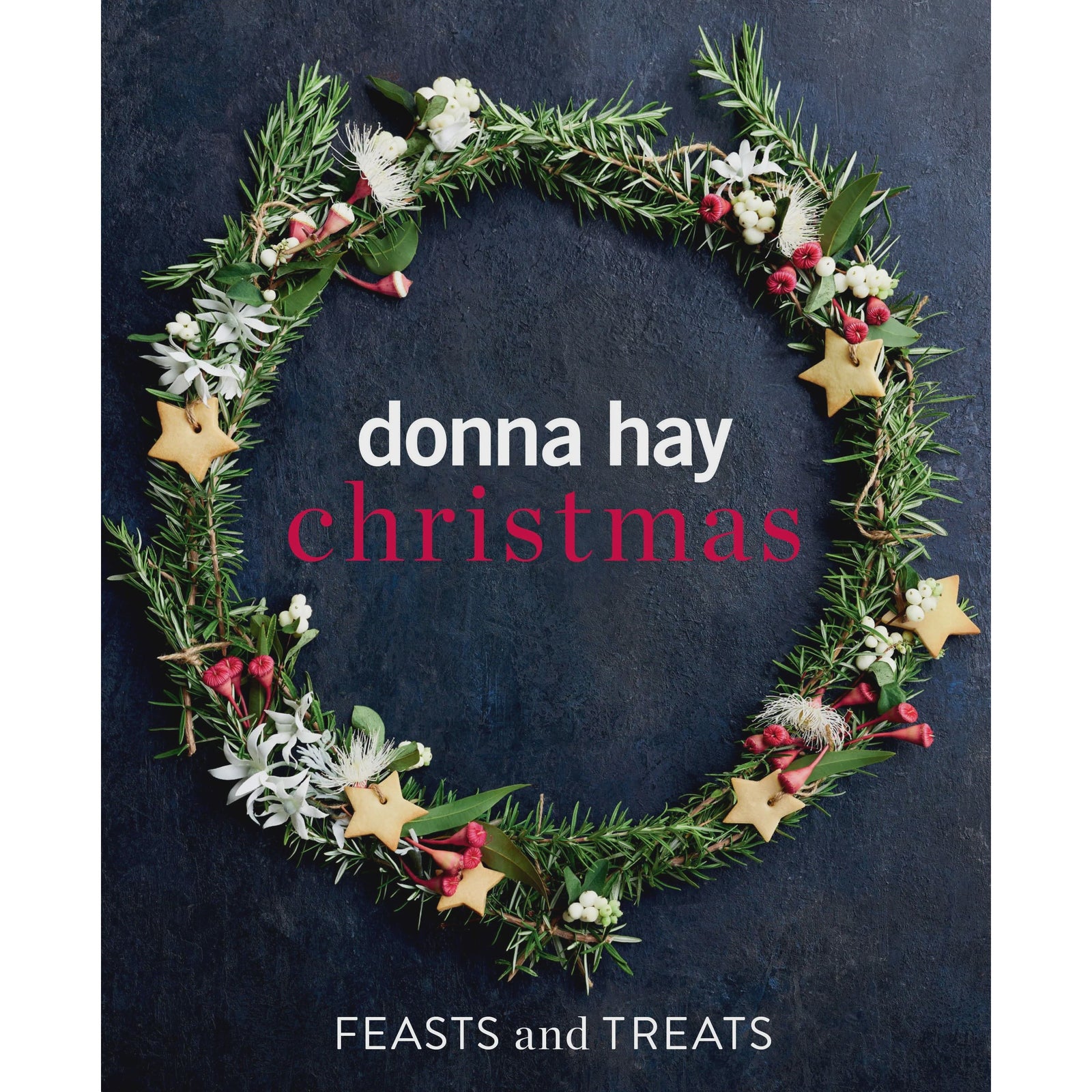 Book cover of 'Donna Hay Christmas: Feasts and Treats' with a festive wreath design on a dark background.
